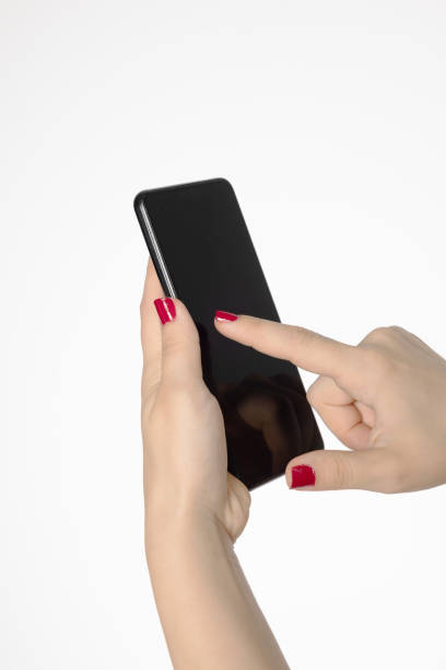 woman's hand with red nail polish holding a phone