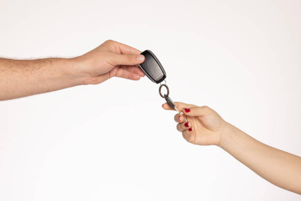 Leather keychain with keys on a light background. Cope space.