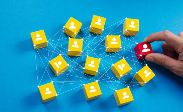 istock Customer relationship management concept, CRM tech. Hand select red block of leadership link on yellow human icon target, customer service focus group, blue background. Hr recruit new employee web 2170126840