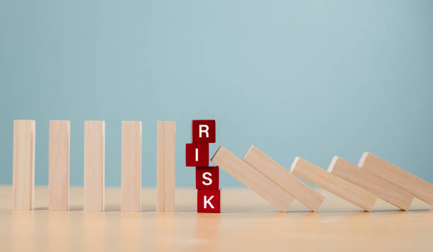 istock Risk assessment crisis concept. Financial analysis solution, real estate business management. Plan to stop economic risk. Risk word on wooden block, domino crisis reduce effect. Insurance security 2170127282