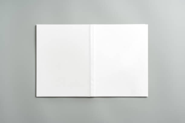 istock Empty White Sheet of Paper Positioned at an Angle on Light Gray Surface 2170127402