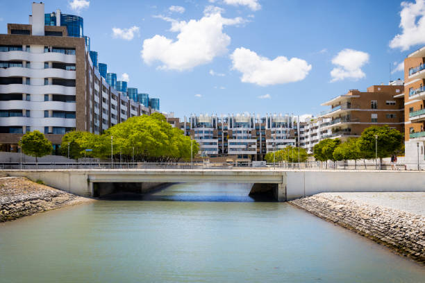 istock New complex of apartment buildings with green trees 2170128341