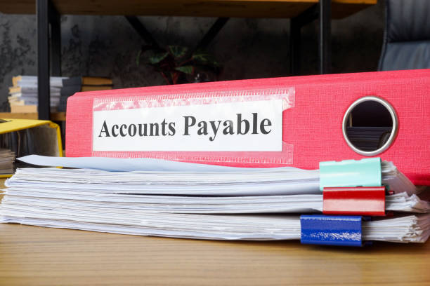 istock Stack of papers and folder labeled accounts payable. Financial management and accounting tasks. 2170128403