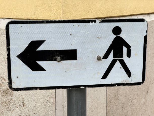 istock Exit arrow sign with pictogram on the street 2170128532