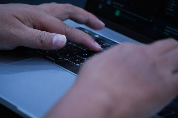 istock Close-Up of Hands Typing on Computer or Laptop Keyboard 2170130479