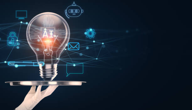istock Lightbulb with AI logo on a tray surrounded by technology icons in a dark background. 2170131068