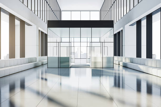 A modern corporate foyer with glass walls, white seating, and a spacious design. The interior is brightly lit with city views. 3D Rendering