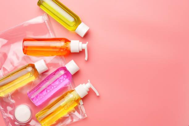 istock Clear Plastic Bag Containing Travel-Sized Toiletries on Pink Background 2170131309