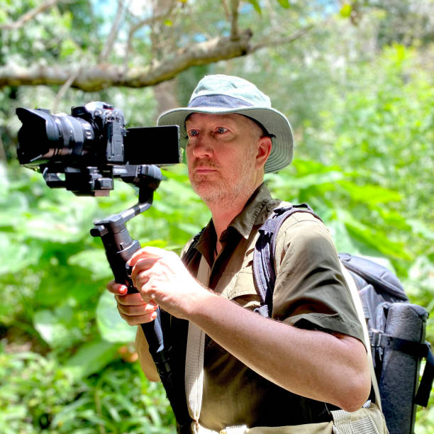 istock Nature photographer at work in rain forest 2170131500