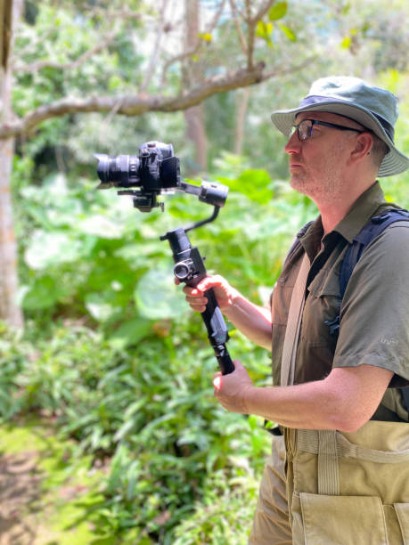 istock Nature photographer at work in rain forest 2170131542