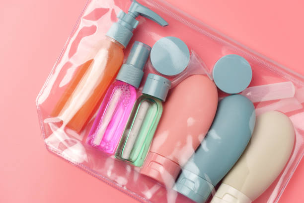 istock Clear Plastic Bag Containing Travel-Sized Toiletries on Pink Background 2170131877