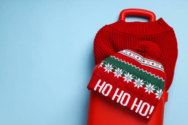 istock A suitcase with a sweater and a hat 2170132765