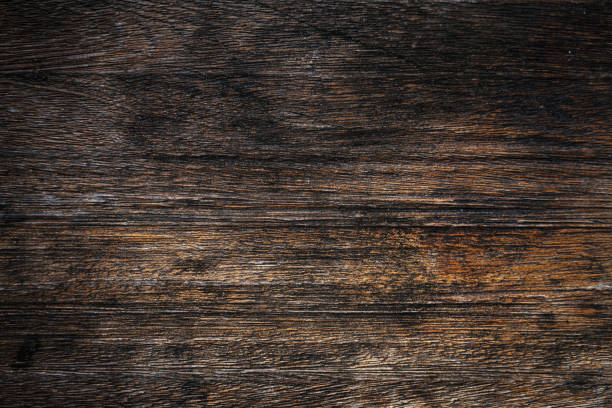 istock Dark weathered wooden boards background 2170132949