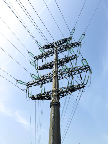istock A pole with electric wires against a blue sky 2170134613