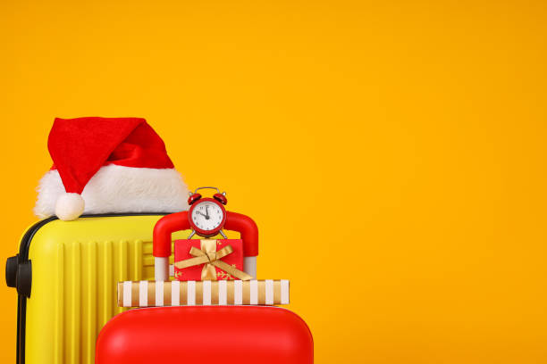 istock Suitcases with a New Year's hat and gifts 2170135783