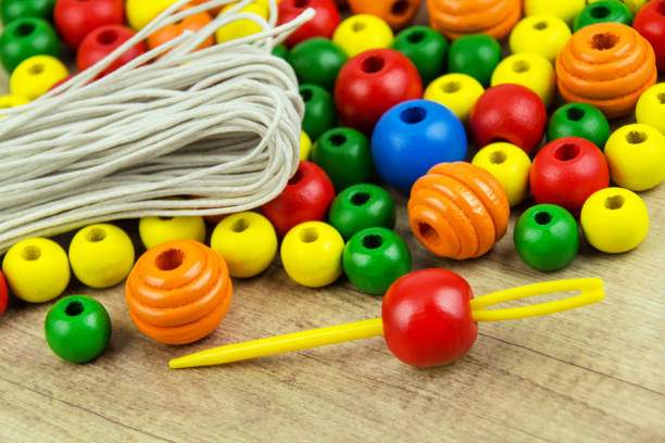 istock Colorful wooden craft beads and needle 2170138403