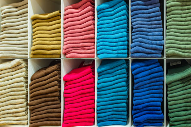 istock Multi colored socks stacked on shelves in the store 2170140794