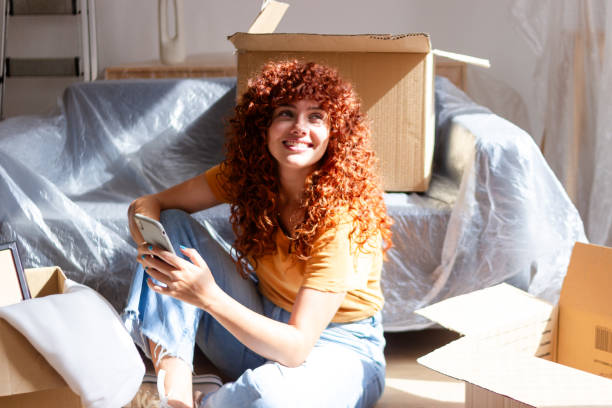 istock Young woman is moving into a new apartment 2170141685