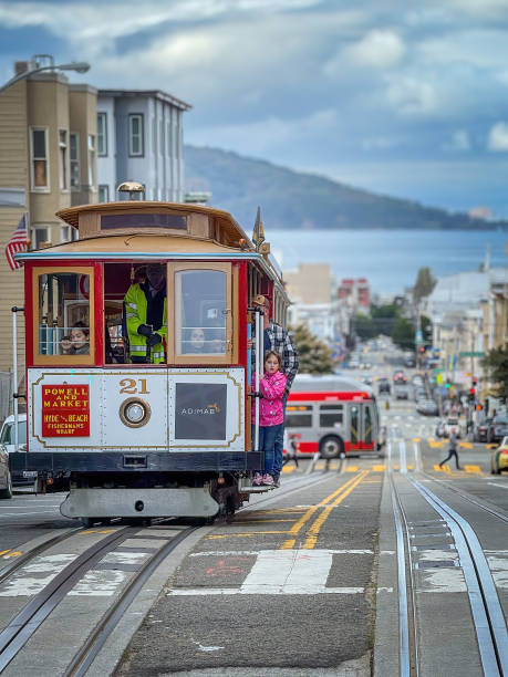 San Francisco, California, USA - April 12, 2024: Cable Car at Hyde Street against cloudy sky