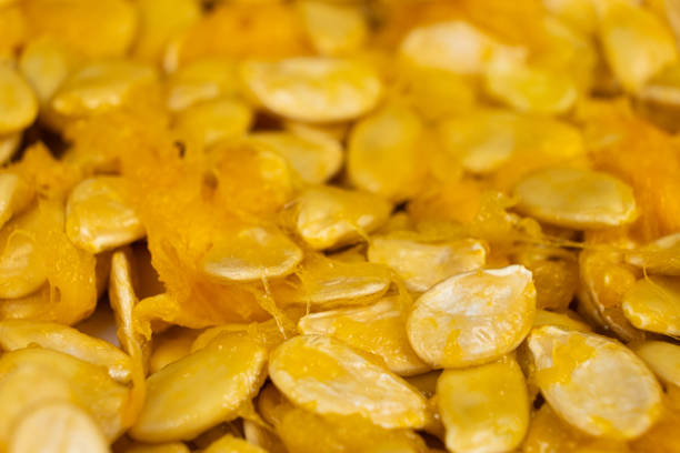 Raw seeds from fresh hokkaido pumpkin close-up.