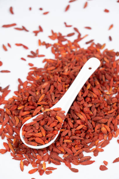 istock Dried Goji berries Lycium barbarum in a spoon on a white background 2170144935