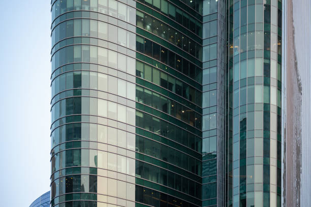 istock Large curved glass facade office building in Dubai, Modern Architectural design commercial tower 2170146111