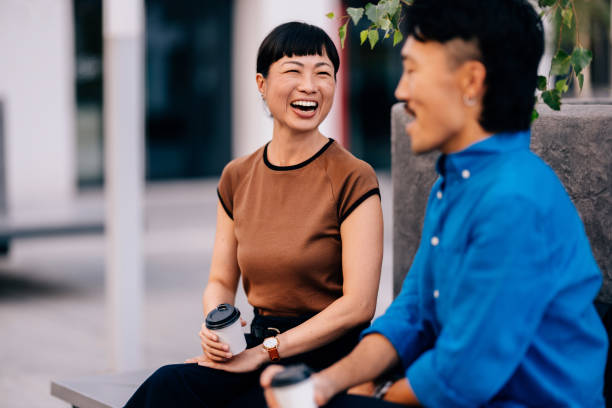istock Smiling Friends Enjoying Coffee and Conversation Outdoors 2170146529