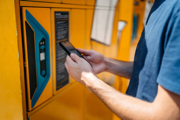 istock Man picks up mail from automated self-service post terminal machine 2170147906