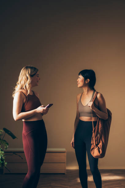 istock Two Women Conversing After Yoga Class in Natural Light 2170148070