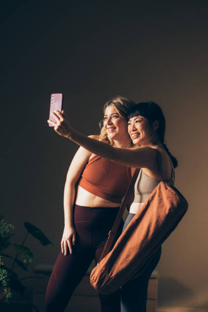 istock Two Women Taking Selfie After Fitness Workout in Studio 2170148074