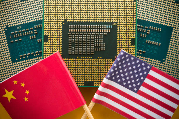 istock US of America and Chinese flag with CPU computer (central processing unit) background. 2170149190