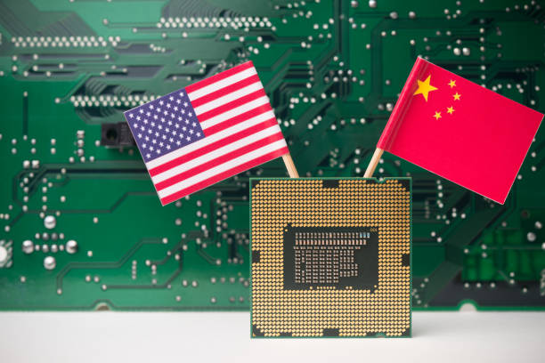 istock CPU (central processing unit) USA and Chinese flag with circuit board background. 2170149196
