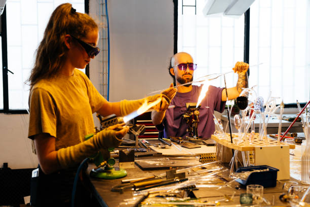 istock Glassblowers Perfecting Their Craft in a Creative Studio Setting 2170149777