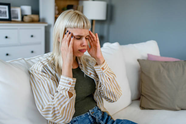istock Young woman suffering from headache 2170149951