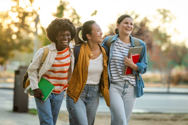 istock Cheerful female students walking in the city 2170150281