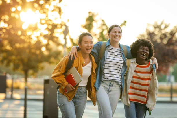 istock Diverse group of female students walking and laughing 2170150283