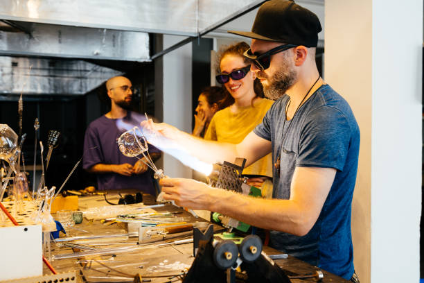 istock Artisan Crafting a Glass Cup With Coworkers at a Creative Studio 2170150529