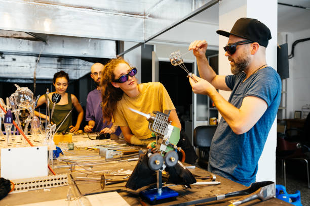 Glassblower Demonstrates Crystal Making to Students in Workshop