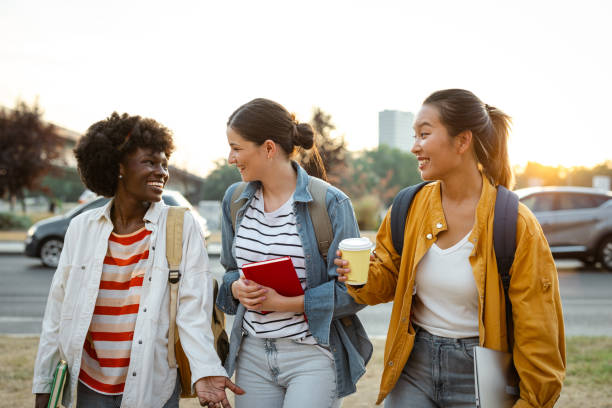 istock Happy female students enjoying in the city after classes 2170153623