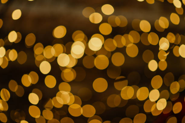 istock golden lights on a black background 2170158385