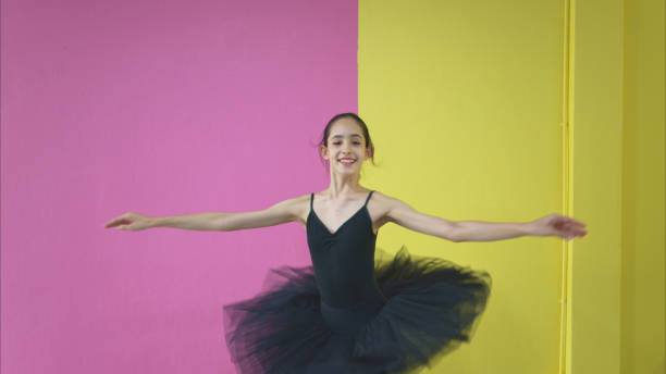 istock A girl ballet student practices ballet dancing at home with a white background 2170160133