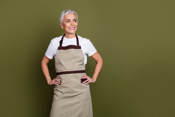 istock Photo of confident attractive lady dressed apron preparing drinks looking empty space isolated green color background 2170161968