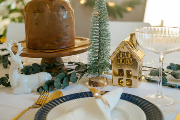 istock Stylish light Christmas table setting with golden cutlery. Festive feasts. Decorations on the New Year's table. 2170165232