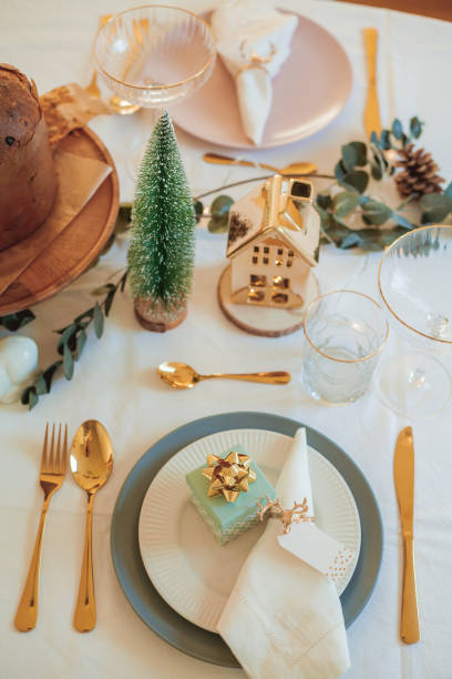 istock Stylish light Christmas table setting with golden cutlery. Festive feasts. Decorations on the New Year's table. 2170165358