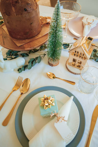 istock Stylish light Christmas table setting with golden cutlery. Festive feasts. Decorations on the New Year's table. 2170165435
