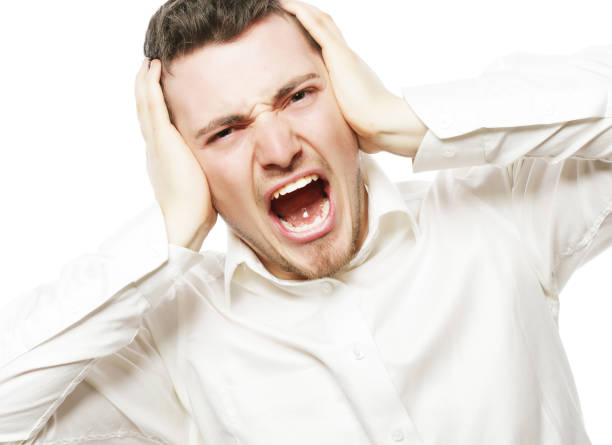 istock young office worker mad by stress screaming 2170166320