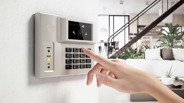 istock A person entering a security code on a digital keypad in a modern home living room 2170167230