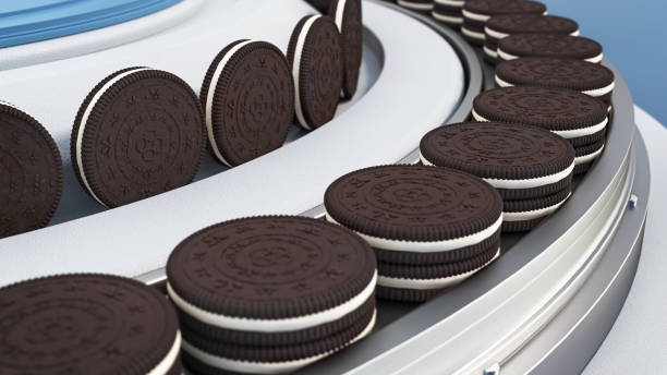 Arrangement of dark chocolate cookies filled with sweet cream in conveyor belt, showcasing their enticing layers and textures. 3D animation