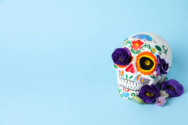 istock Mexican skull and flowers on blue background, space for text 2170167975
