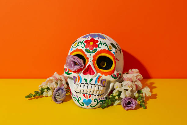 istock Mexican skull and flowers on orange background 2170168139